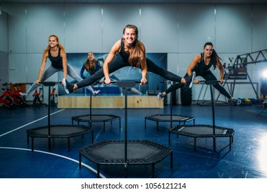 Women group on sport trampoline, fitness workout