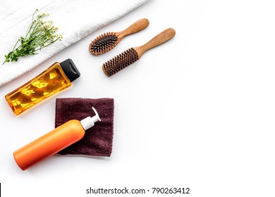 Women hair care set. Comb, shampoo, spray, towel on white background top view copy space - Shutterstock ID 790263412