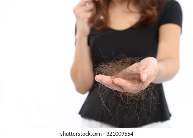 women with hair problem holding loss hair in hand, isloated on white background