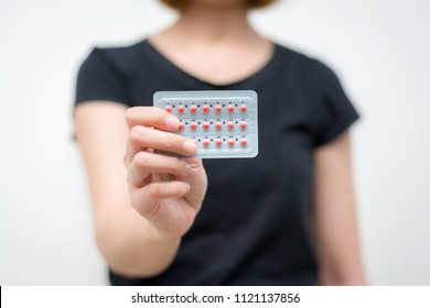 Women Hand Holding Combined Oral Contraceptive Pill