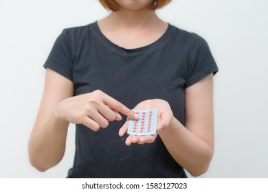 Women Hand Holding Combined Oral Contraceptive Pill