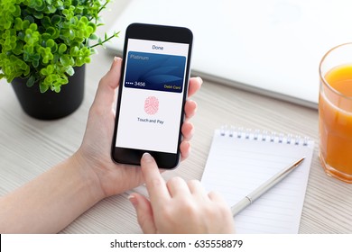 Women Hand Holding Phone With Debit Card App Touch Pay On Screen