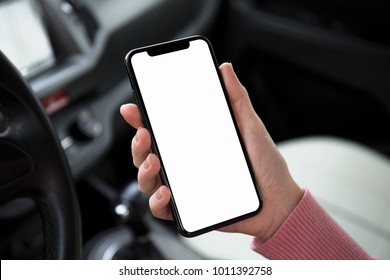 Women Hand Holding Phone With Isolated Screen In The Car