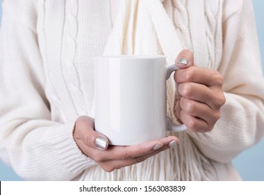 women hand holding white ceramic coffee cup. mockup for creative advertising text message or promotional content. - Shutterstock ID 1563083839