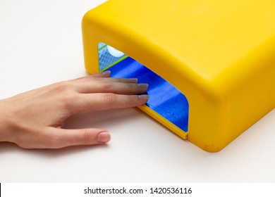 Women Hand Inside UV  LED Lamp. Close Up