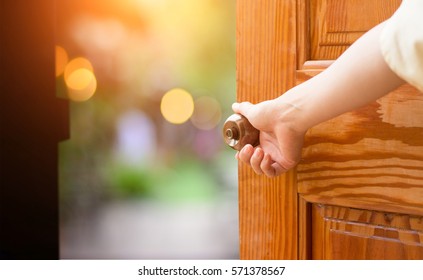 women-hand-open-door-knob-260nw-571378567.jpg