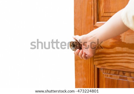 Women hand open door knob or opening the door isolated on white.