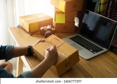 Women Hand With Packing Cardboard Box At Workplace, Online Selling E-commerce Shipping Idea Concept