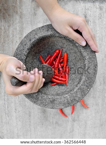 Women hand prepare cooking spicy food