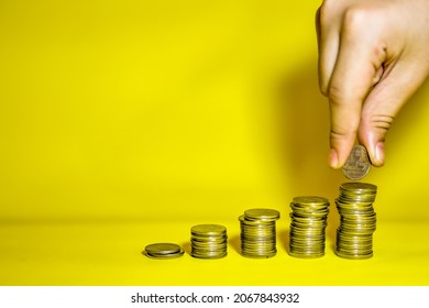 Women Hand Putting Coin Over Coin Stack. Real Estate Or Property Investment Growing Business. Home Mortage Loan Rate.