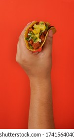 Women Hand With Taco Al Pastor