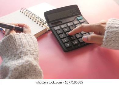 Women hand using calculator on office desk  - Shutterstock ID 1877185585