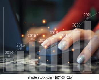 Women Hand Using Wireless Mouse With Statistical Concept