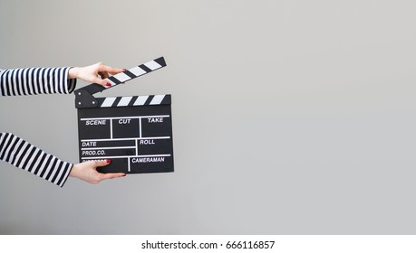 Women Hands Holding Clapper Board Making Video Cinema In Studio.Movie Production Clapper Board, Slate Film.Action, Theatre Day.cut, Director, Film Industry, Bollywood, Hollywood.Video Live Streaming.
