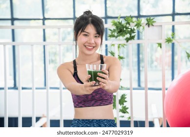 Women hands holding smoothie detox green juice fresh fruit cool drinking. Asian women smile laugh drinking vegan vegetable cool wellness beverage. Female pouring celery juice drink cocktail glass - Powered by Shutterstock