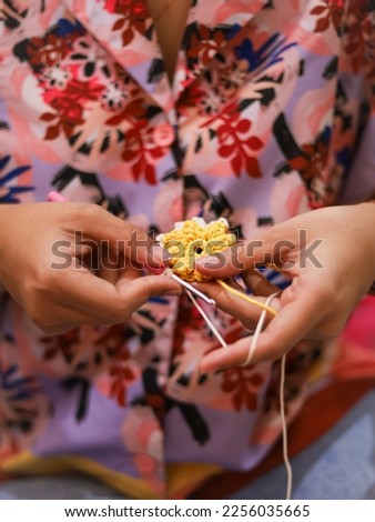 Women hands knitting crochet. Crochet hook. Crocheting or knitting project
