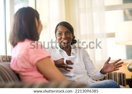 Women having coffee and talking￼