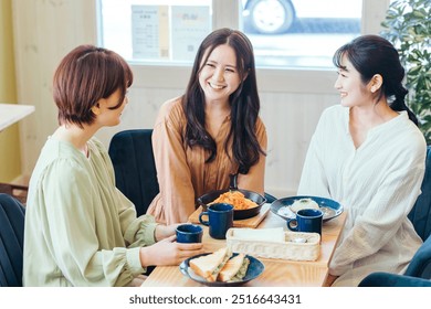 Women having lunch at a girls' gathering - Powered by Shutterstock