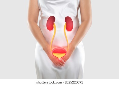 Women having urethritis and Urinary Incontinence. Female with hands holding her crotch
