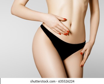 Women health and intimate hygiene. Beautiful Woman's body with smooth soft skin in black bikini panties. Epilation Concepts