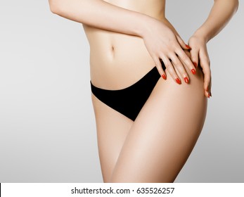 Women health and intimate hygiene. Beautiful Woman's body with smooth soft skin in black bikini panties. Epilation Concepts