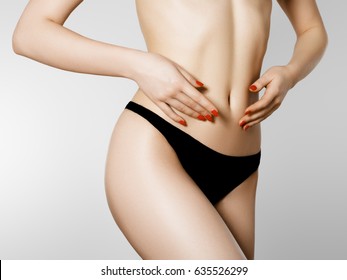 Women health and intimate hygiene. Beautiful Woman's body with smooth soft skin in black bikini panties. Epilation Concepts