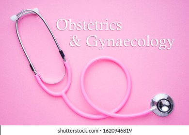 Women In Healthcare Concept. A Pink Strethoscope On A Pink Background With Obstetrics And Gynaecology Text.