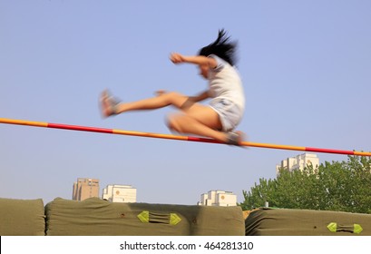 Women High Jump Athletes In The Playground