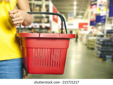 Women Holding Empty Shopping Basket - Shopping Concept