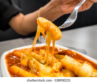 Women Holding Fork With Tteokbokki Cheese Stretch 