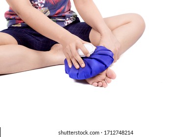 Women Holding Ice Bag Compress To
Sole Of The Foot, Relieving Pain.isolated On White Background