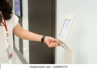 Women Holding Key Card Access Control  To Unlock Elevator Floor And Choose  The Floor