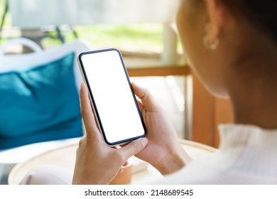 A women holding phone showing white screen - Shutterstock ID 2148689545