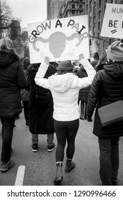 Women Holding Sign Saying 