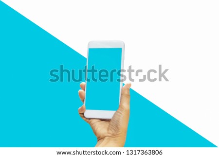 Women holding smartphone in hands with blue screen on bright blue-white pastel background. With concept of technology and simplicity and convenience,with empty copy space and for text and image 