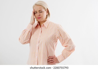 Women Hormonal Headaches. Middle aged woman with Menopause migraines isolated on white background. Copy space. Strong and hard female pain. Depression and stress health problem. - Shutterstock ID 2200755793
