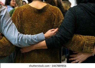 Women Hug While Dancing In A Women's Circle