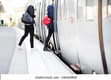 Women in hurry enters train