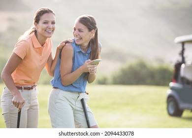 Women Laughing On Golf Course