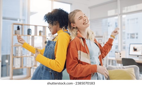 Women, lesbian couple and dance in home, happy and air guitar in living room. Gay girls, party and moving to music in celebration, bonding or smile for freedom, energy or excited in interracial house - Powered by Shutterstock