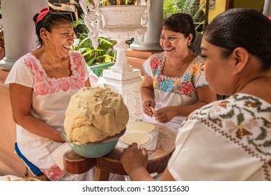 Women making Tortillas
Group of smiling cooks preparing flat bread tortillas in Yucatan, Mexico