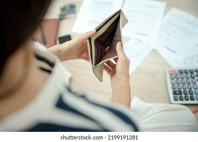 Women  Managing Debt And Expenses. People Holding Wallet But No Money To Pay Credit Card.  Broke, Mortgage, Loan, Bankruptcy, Bankrupt, Can't To Pay 