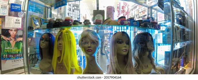 Women Mannequin Heads With A Fake Hair In The Window At Night  In A Poor Neighborhood, New York, Bronx, Lydik Avenue, 10462, United States Of America, 10.13.2021