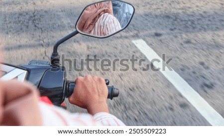 women motorcycle rider hands on handle bar in the road

