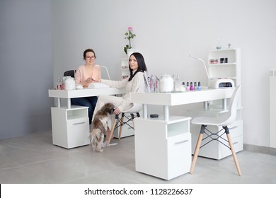 Women At Nail Salon. Manicure Treatment, Filing Nails