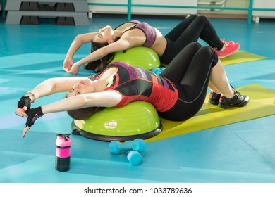 Women On Balance Board Doing Exercise