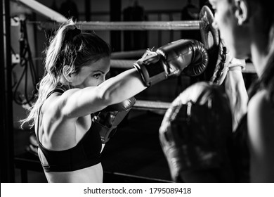 Women on boxing training . Black and white - Powered by Shutterstock