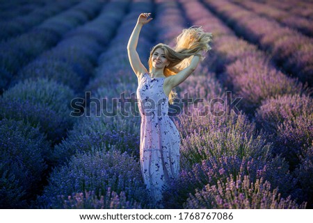 Similar – Woman posing in flower field with a handkerchief