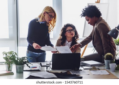 Women Only Business Office. Woman Entrepreneur. Diverse Business Team Discussing Work In Their Creative Office.