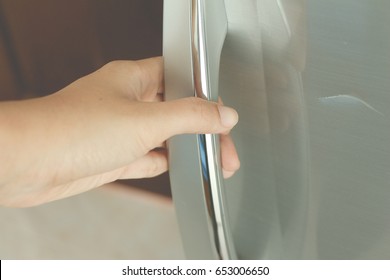 Women Open Refrigerator.